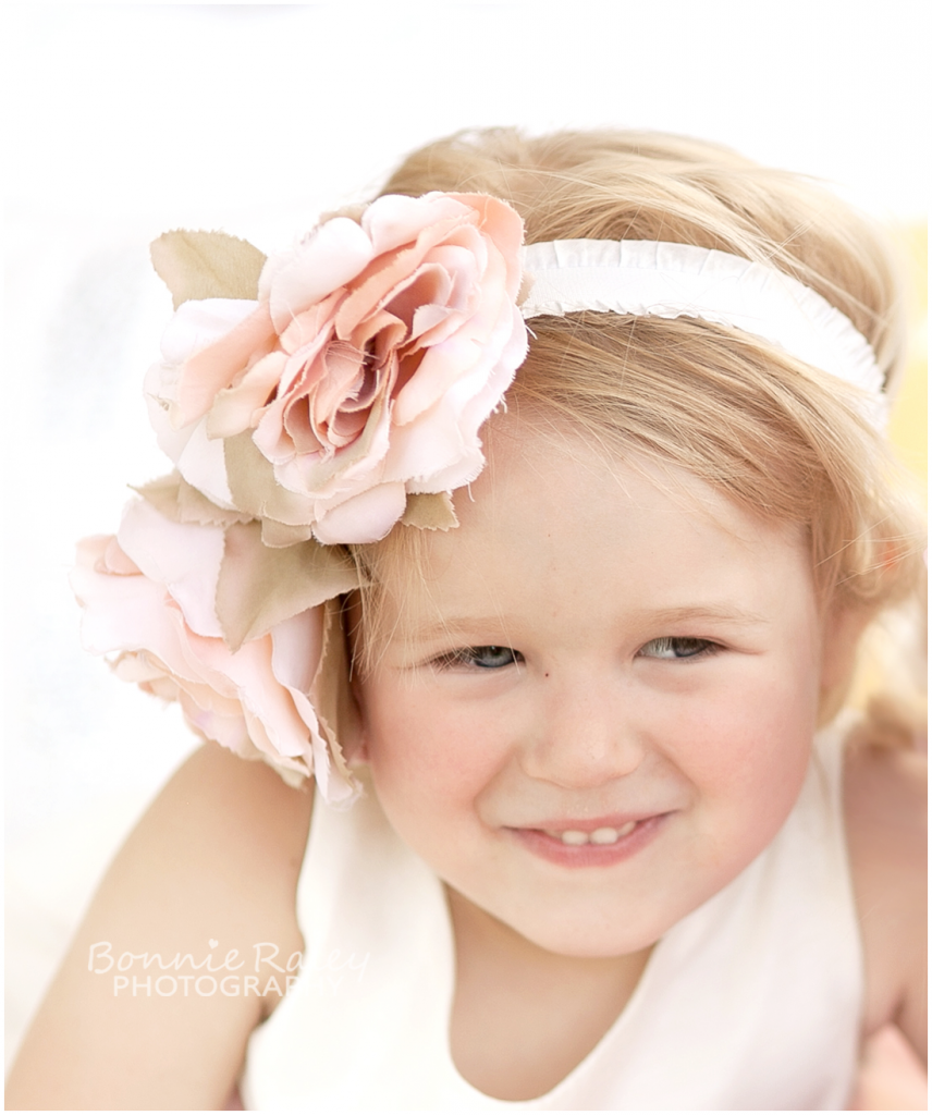 blonde 4 year old girl with flowers in hair