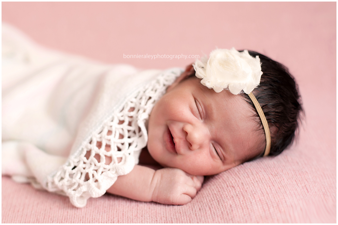  newborn baby girl smiling