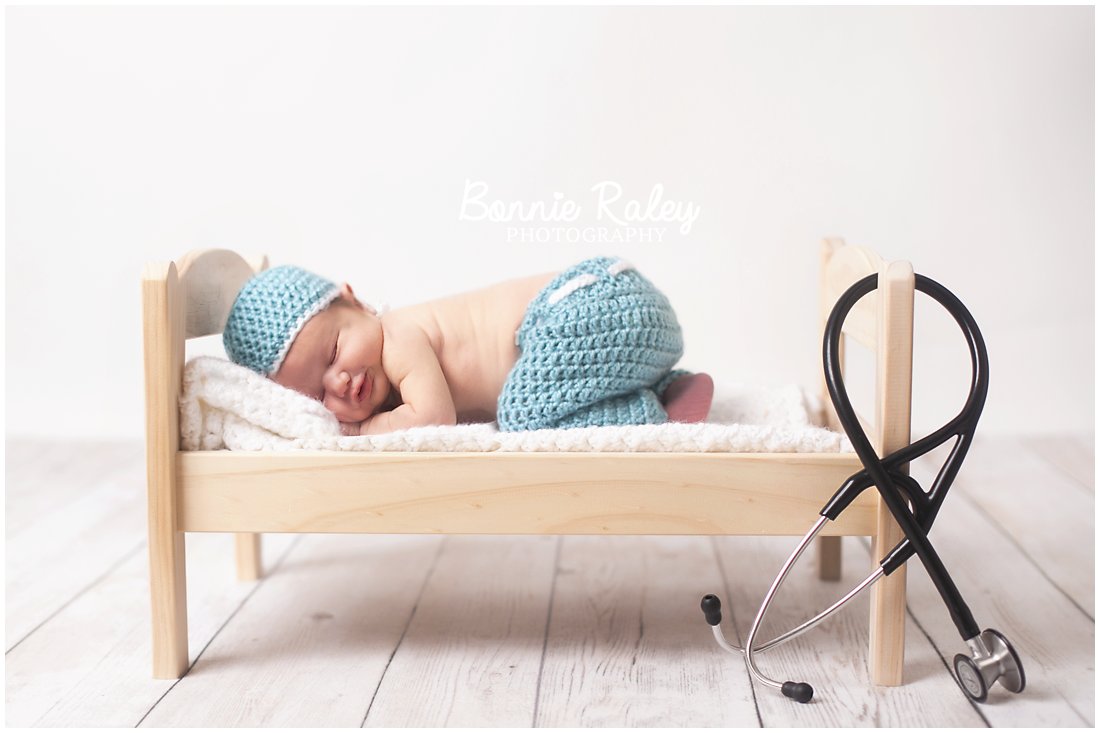 newborn baby boy as doctor {main line newborn photographer}