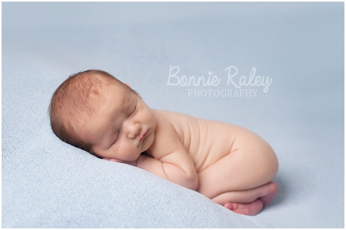 newborn baby boy on blue blanket {main line newborn photographer}
