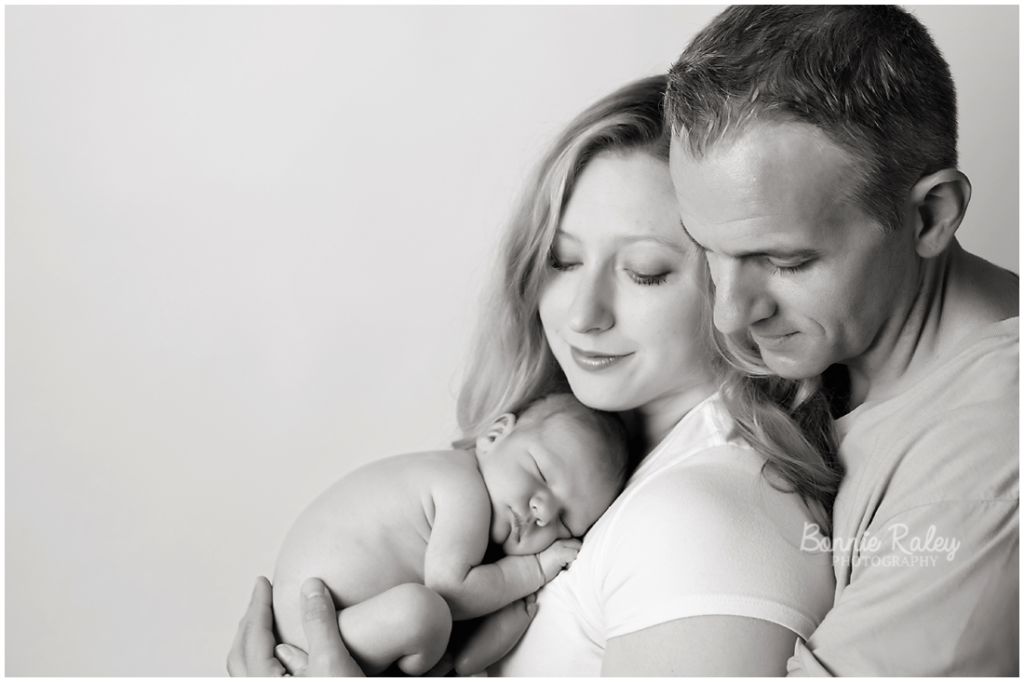 beautiful black and white family portrait with newborn son