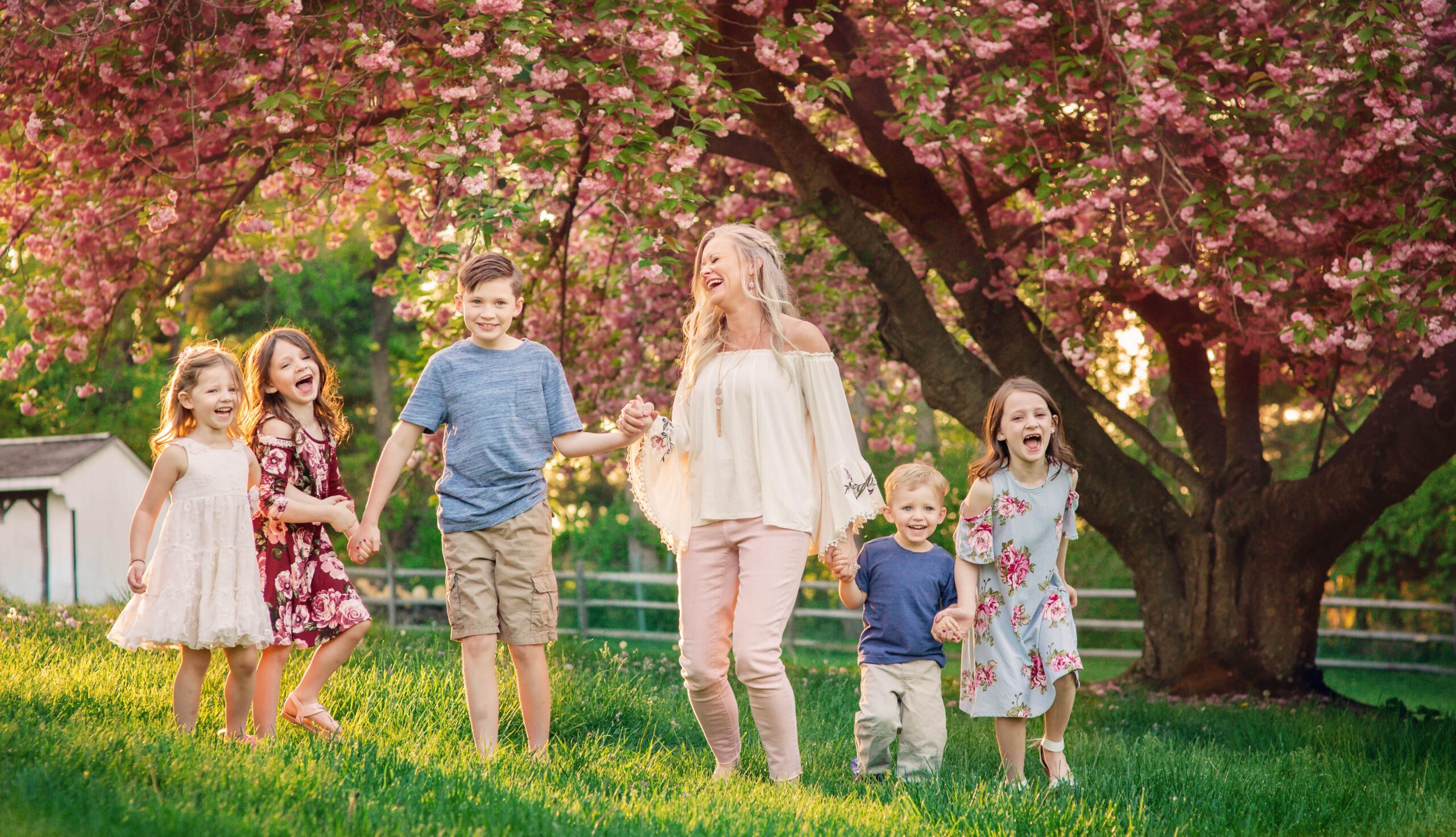 West Chester PA family photographer cherry blossom session with mom and children outdoors