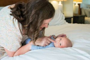 Philadephia mom in neutral tone outfit for newborn photo
